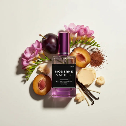 Perfume bottle labeled 'Moderne Vanille' surrounded by flowers, fruits, and vanilla beans on a light background