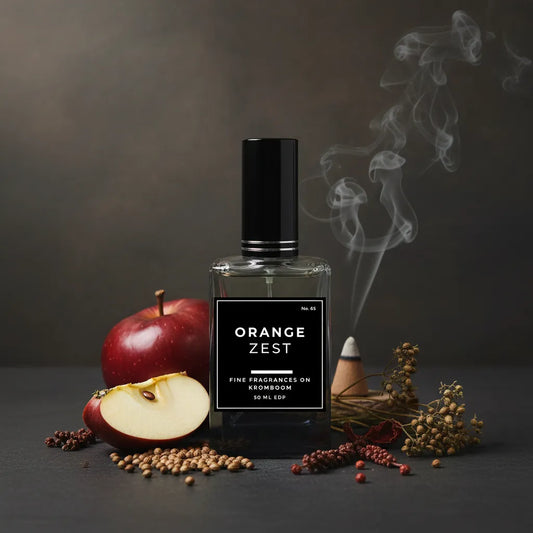 Perfume bottle labeled 'Orange Zest' with apples and spices on a dark background