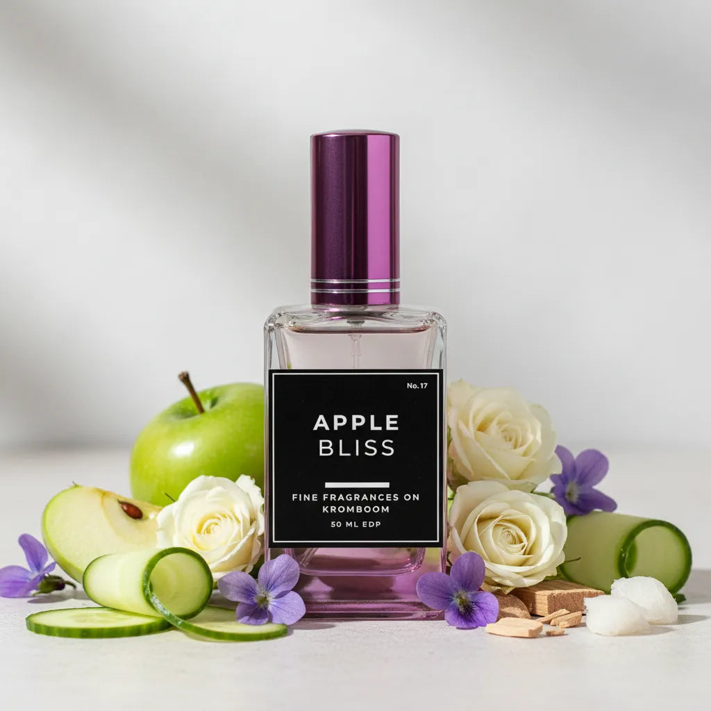Perfume bottle labeled 'Apple Bliss' with apples, roses, and cucumbers on a light background