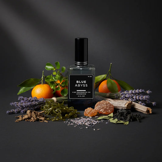 Perfume bottle labeled 'Blue Abyss' surrounded by fruits, herbs, and flowers on a dark background