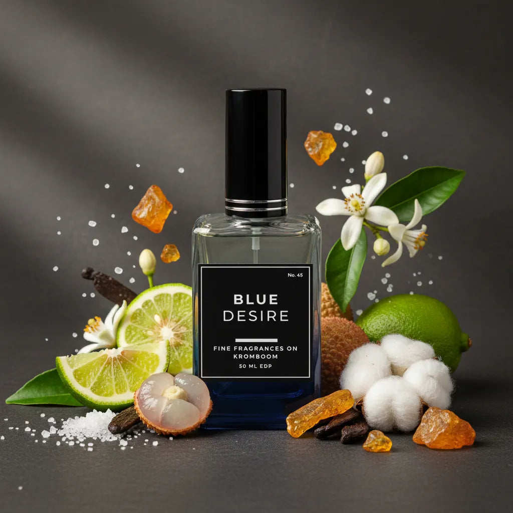 Perfume bottle labeled 'Blue Desire' surrounded by floral and fruit elements on a dark background