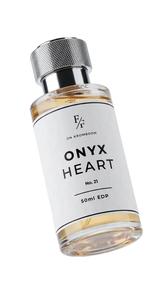 Perfume bottle labeled 'Onyx Heart' by Fine Fragrances on Kromboom on a white background